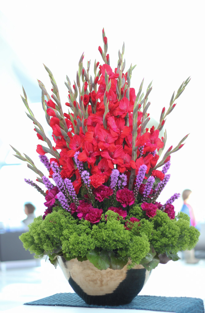 Here's a bold and bright layered arrangement designed by Carrie Kroening and Brooke Scott of Petals Floral Design